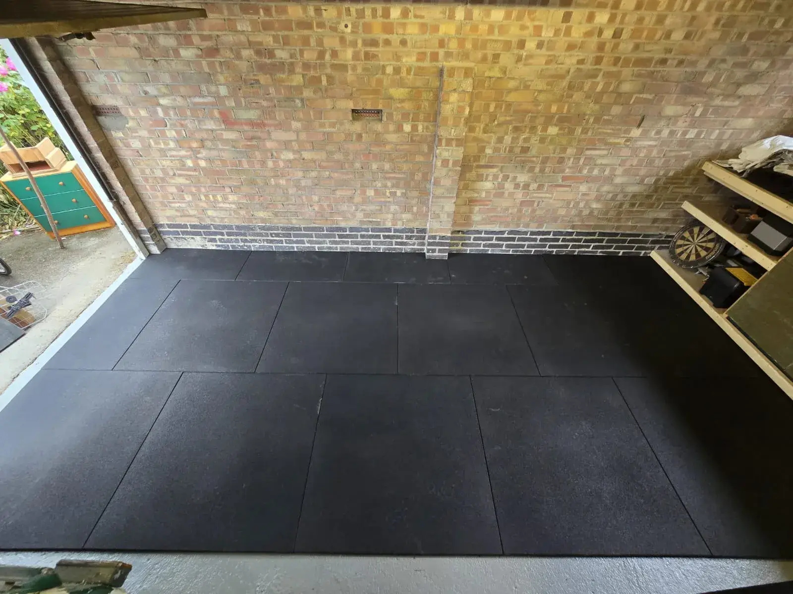 Rubber gym flooring tiles laid in a garage