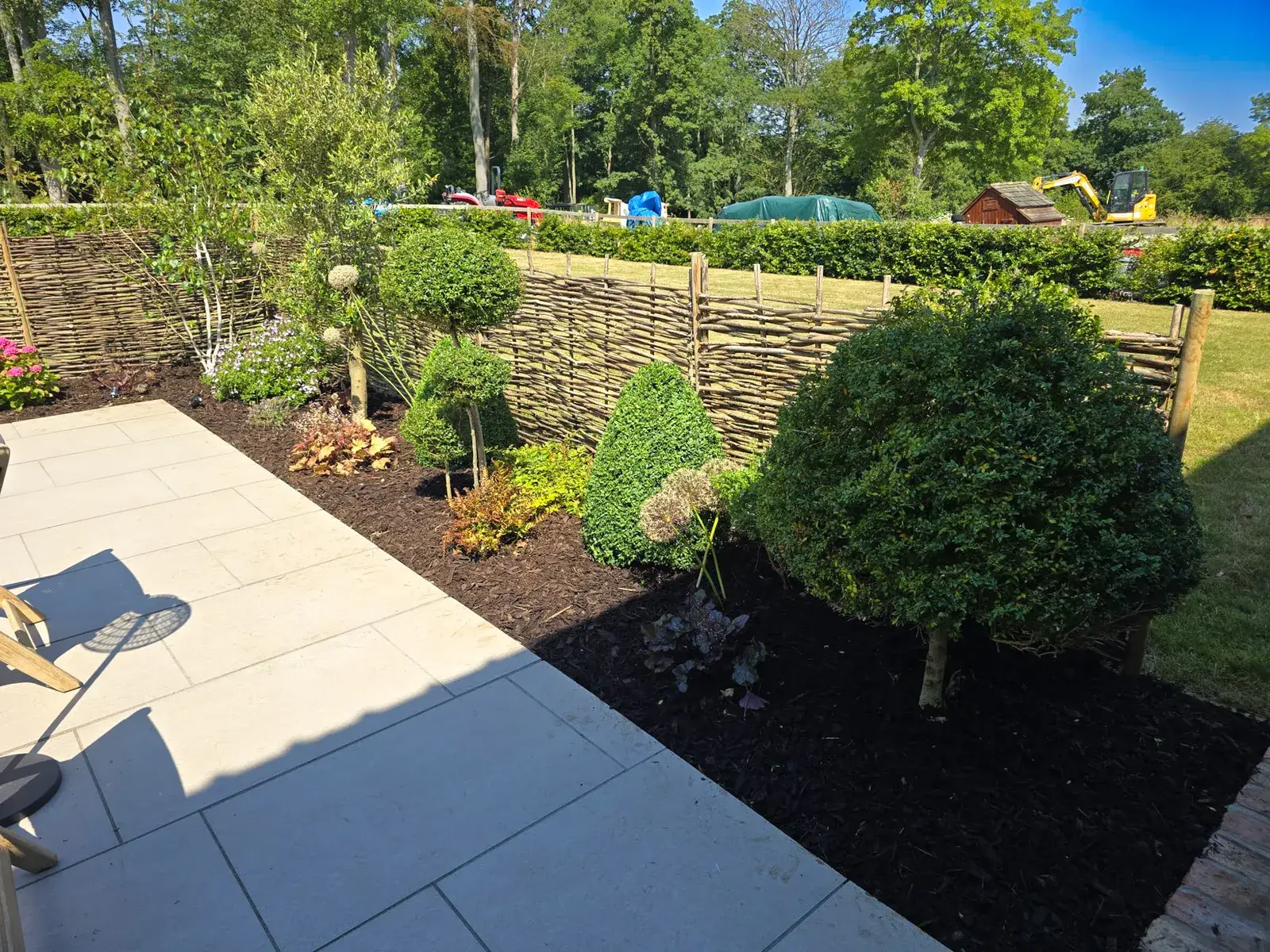 New patio border with hazel hurdle fencing